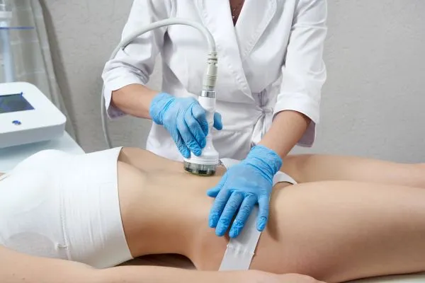 Lost the Weight but Not the Loose Skin? 2 woman having HIFU treatment on her stomach to combat loose skin Stoulton following weight loss